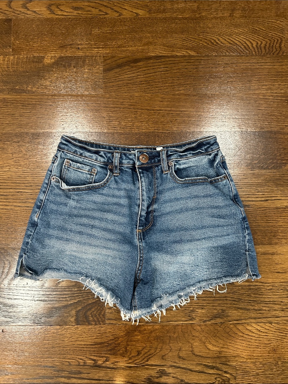 High-Rise Distressed Denim Jean Shorts in Medium Blue